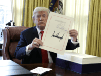 President Donald Trump Signs Historic Tax Cut Bill; Offers Pens to the Media