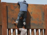 Illegal Aliens Climb Border Wall into U.S. to Taunt Trump